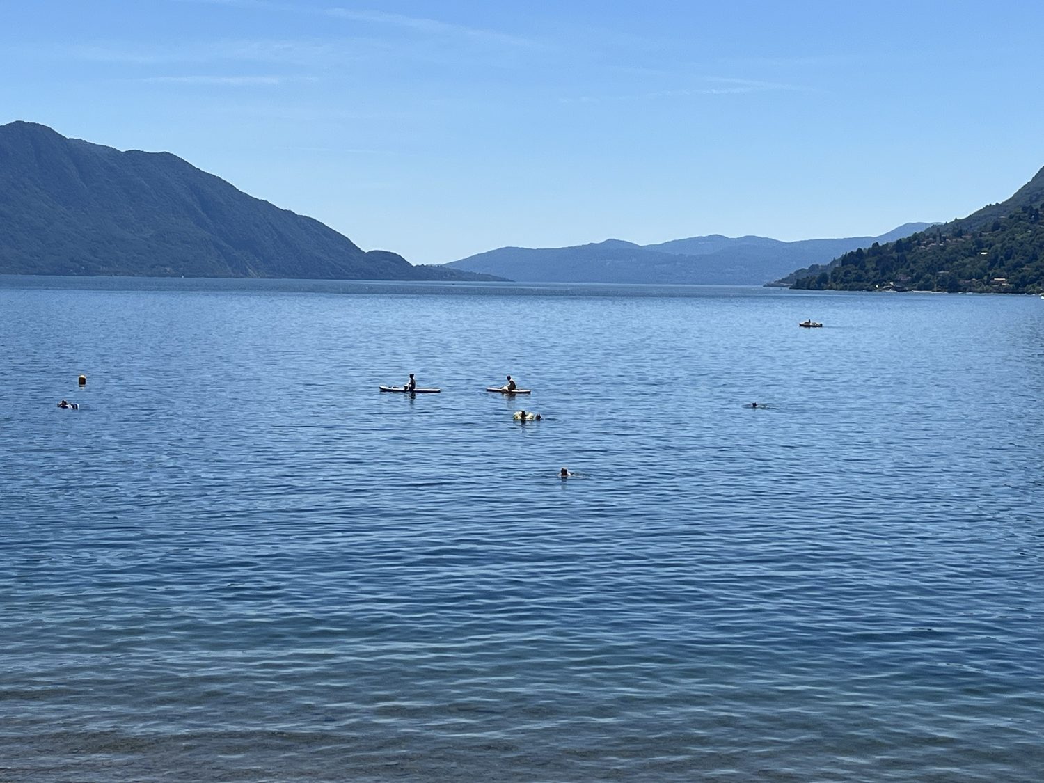 Swimmers and paddleboarders on Lake Maggiore