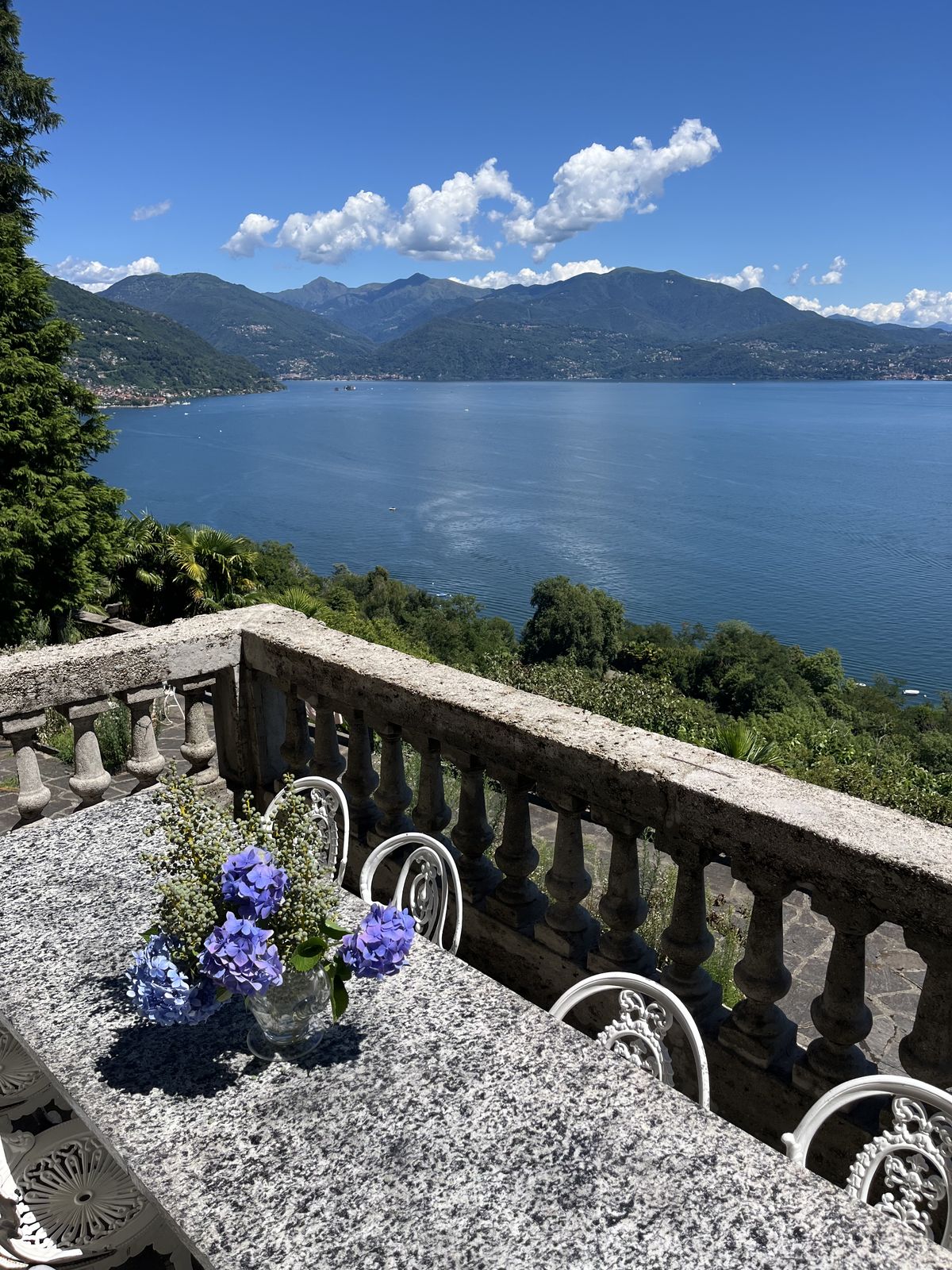 The lake and mountains seen over the balcony balustrade
